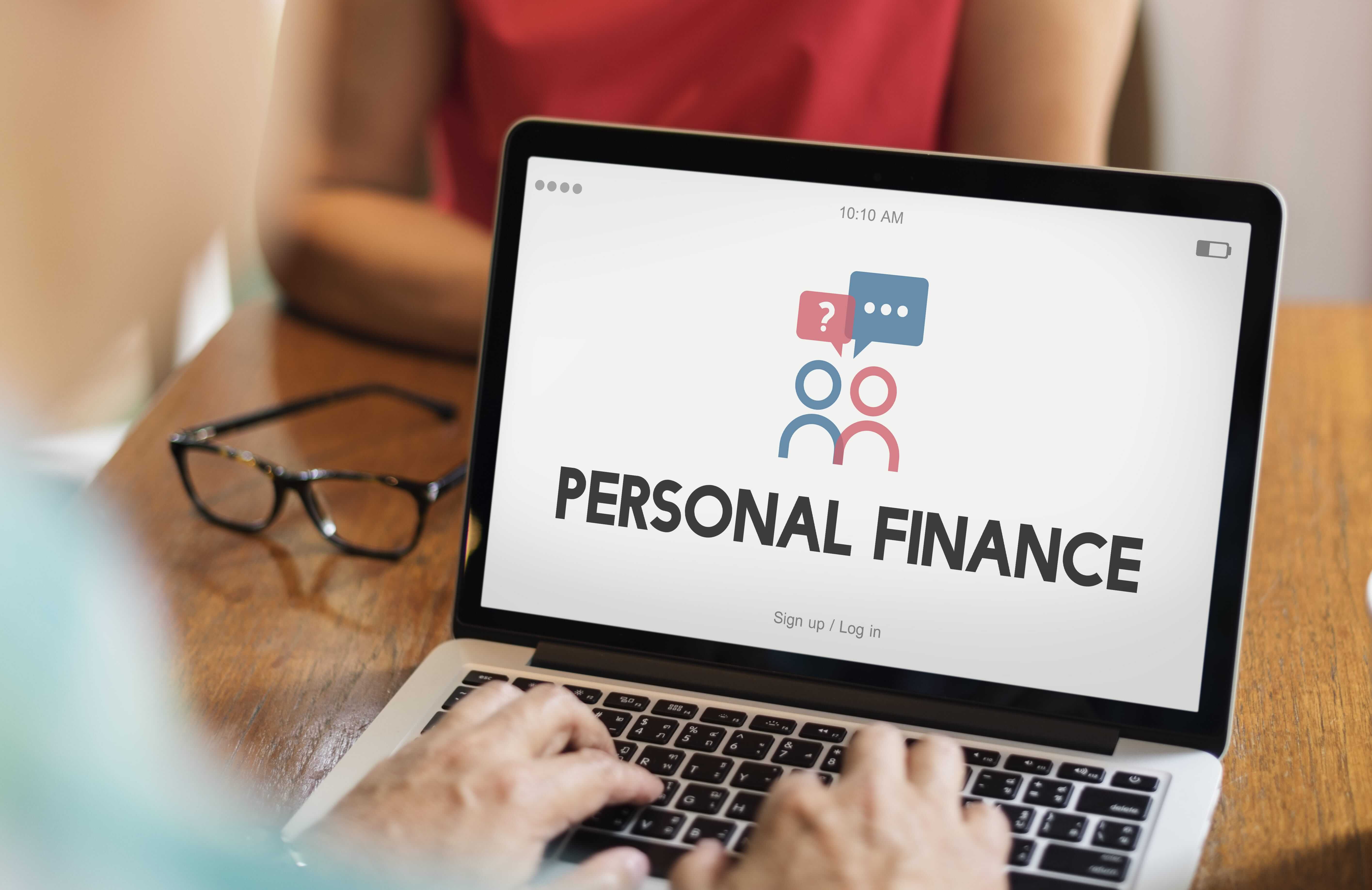 Banner image of a laptop with personal finance written on the screen.