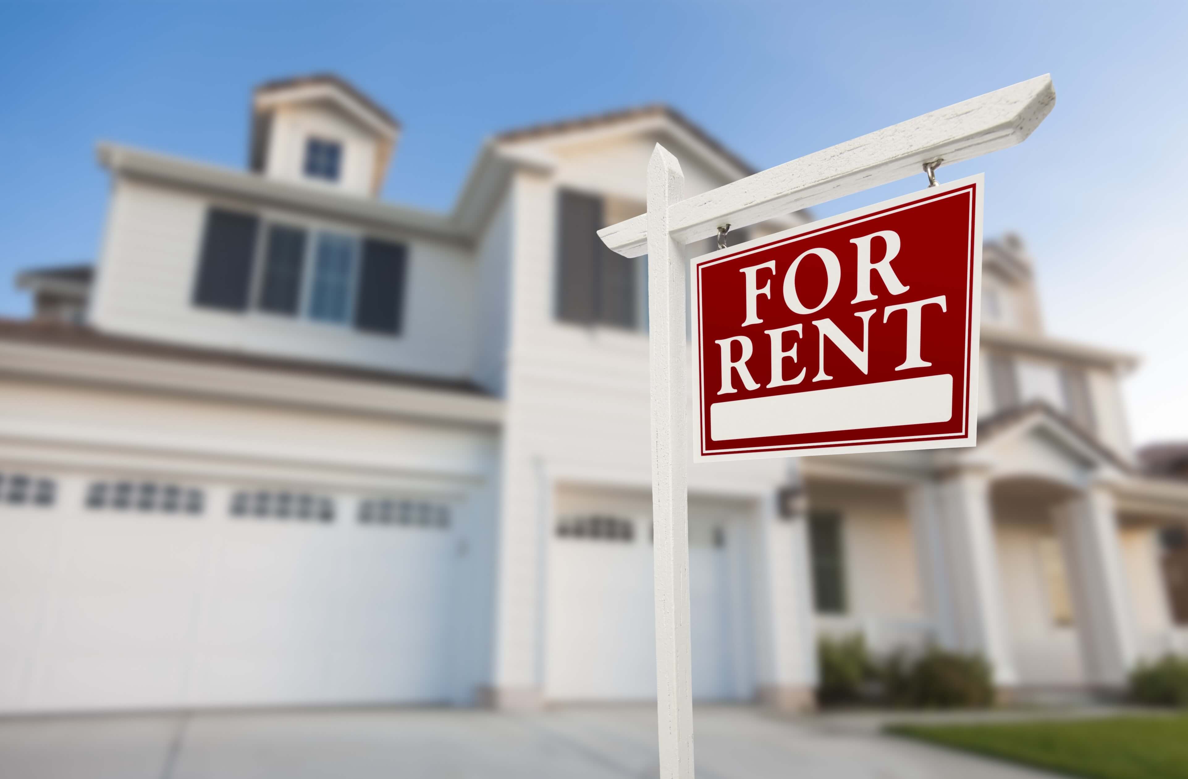 Image of For Rent sign in front of a rental property