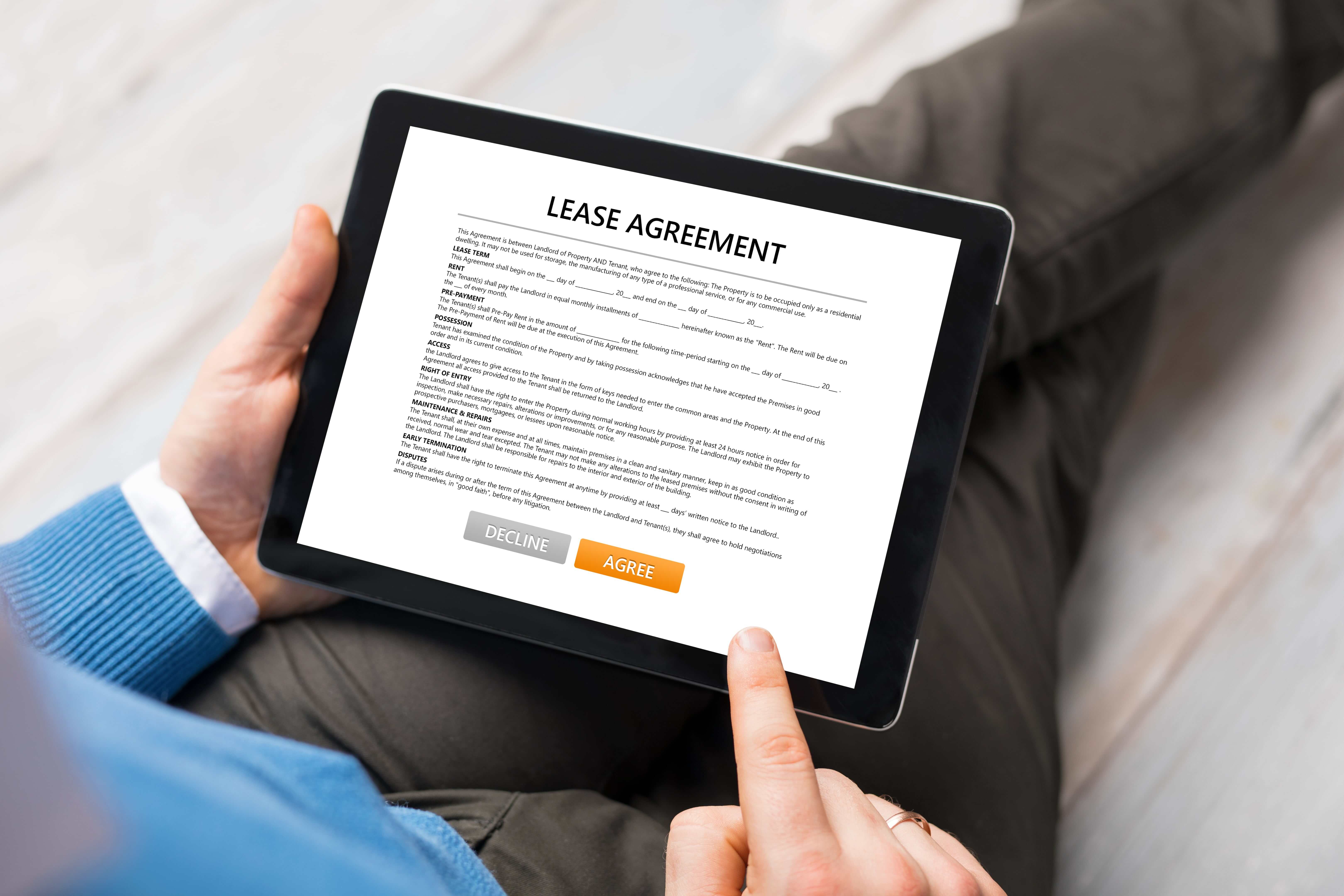 Image of a tablet with a leasing contract on the screen
